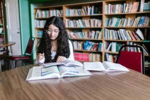 Student studying at a clean desk after 30 days of practicing how to focus on studies without distraction at home