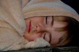 "Person following a relaxing bedtime routine to learn how to sleep early at night for better sleep and health."