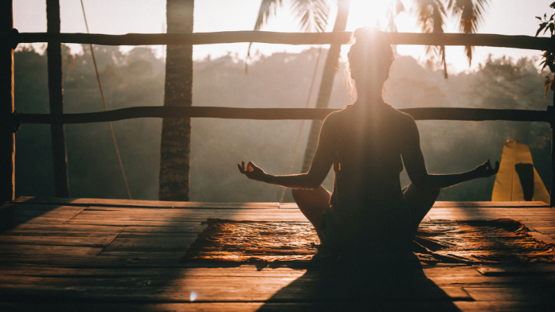 Yoga for beginners practicing simple morning pose showing calm mind and improved flexibility over time