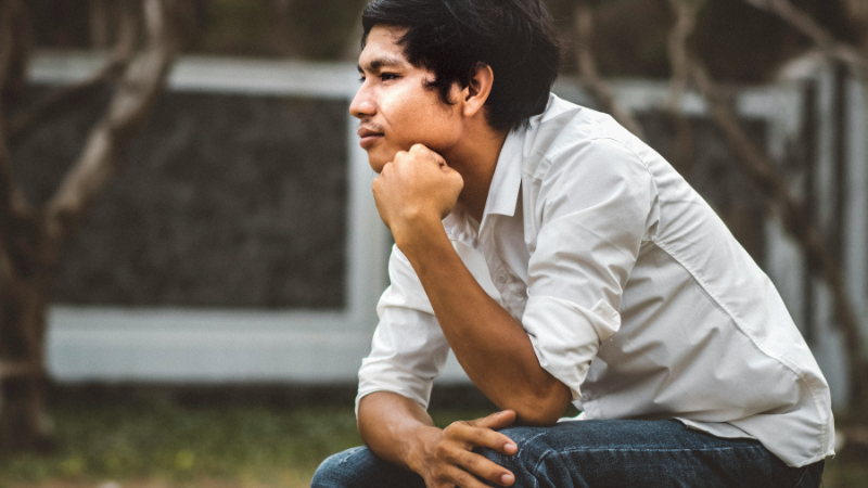 Person feeling stuck and overthinking alone, representing what to do when you don’t feel like doing anything and mental burnout state